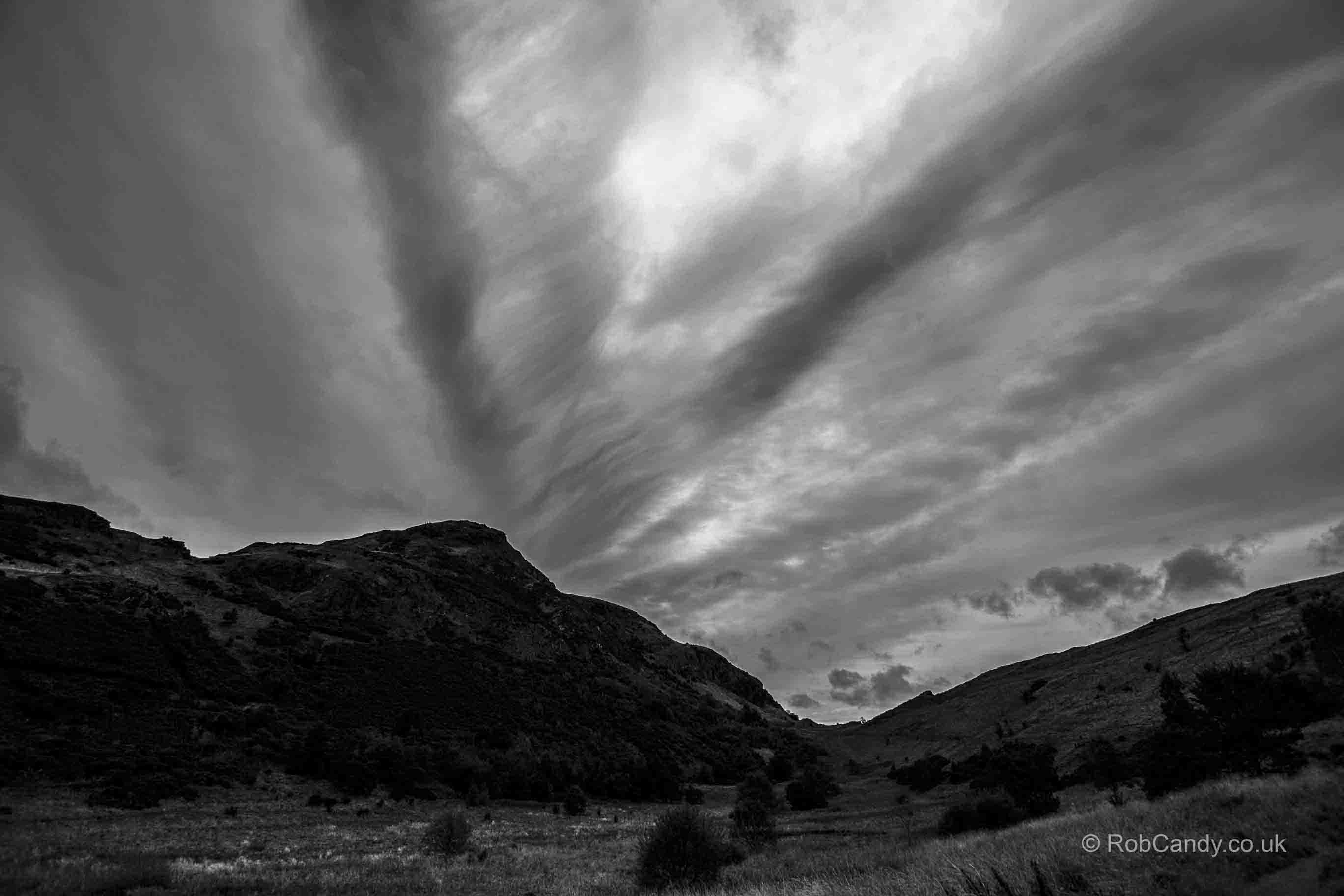 <p>Clouds leading to Edinburgh's Arthur's Seat</p>